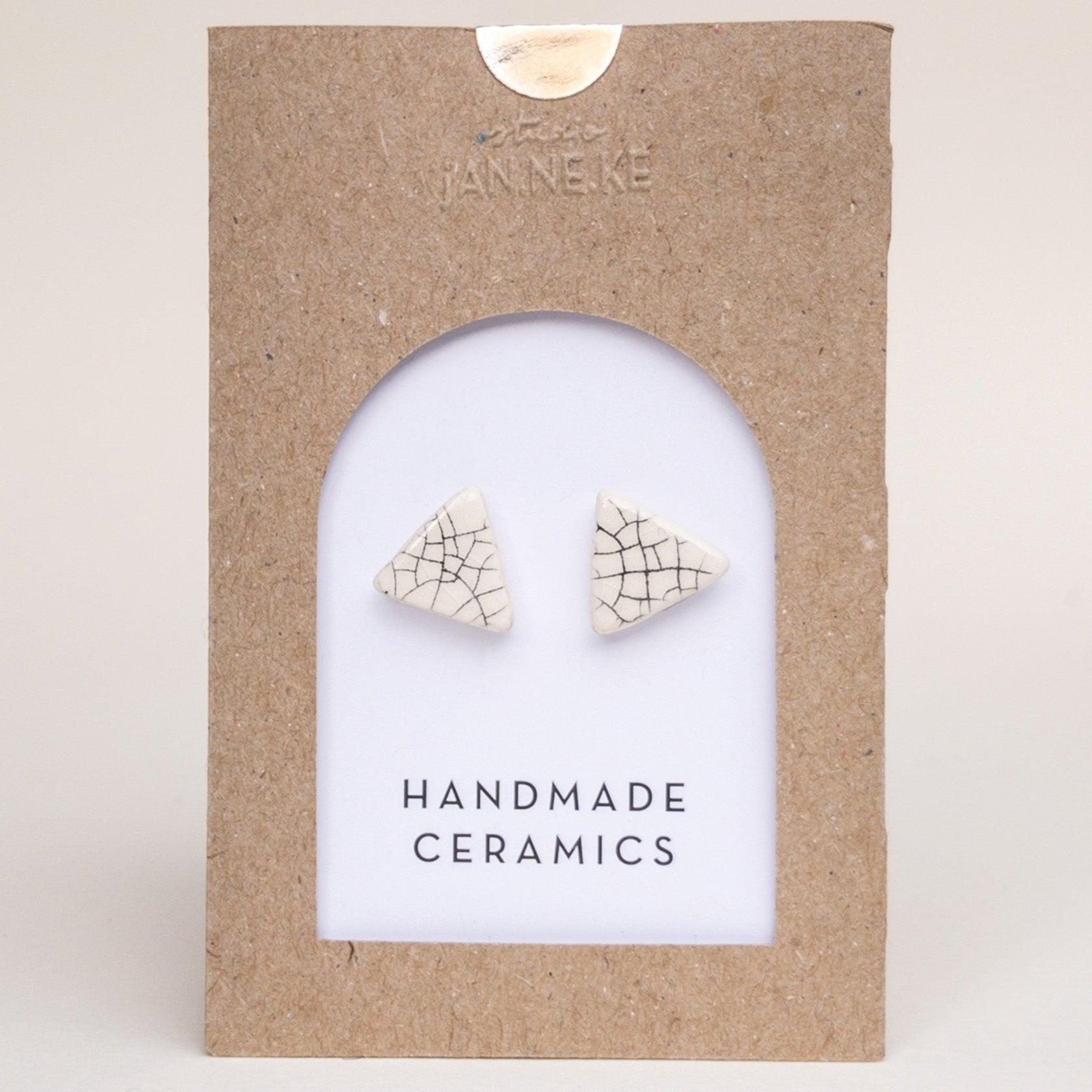 Crackle triangle studs by Janneke