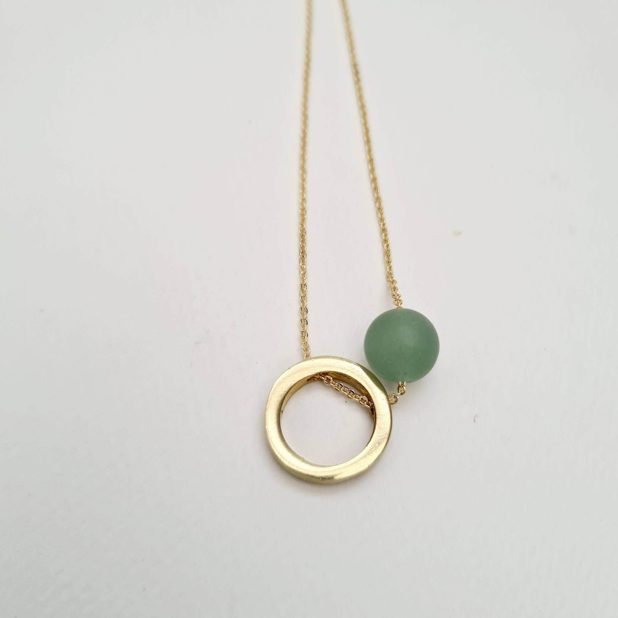 Brass circle & green aventurine necklace by brass + bold