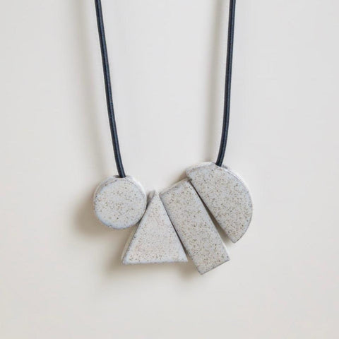 Geo tangram gloss speckle necklace by Janneke