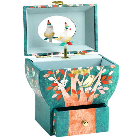 Musical box singing bird in tree